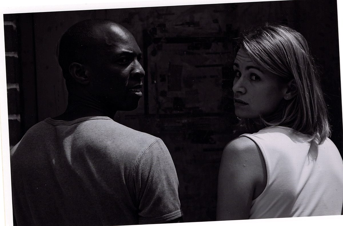 Boris Willis and Cynthia McLaughlin glancing back over their shoulders