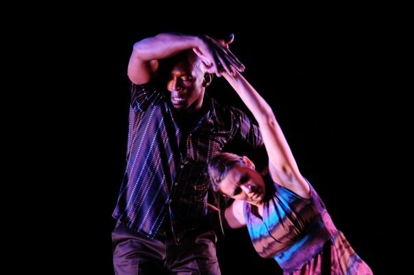 Boris Willis and Cynthia McLaughlin with arms entwined overhead