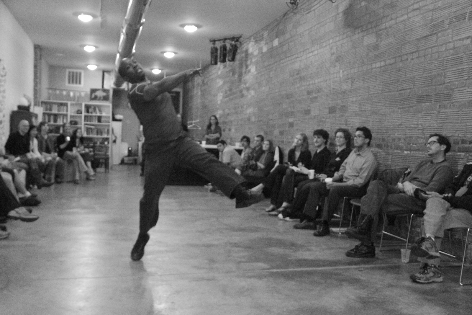 Boris Willis arching backward with one leg kicked high