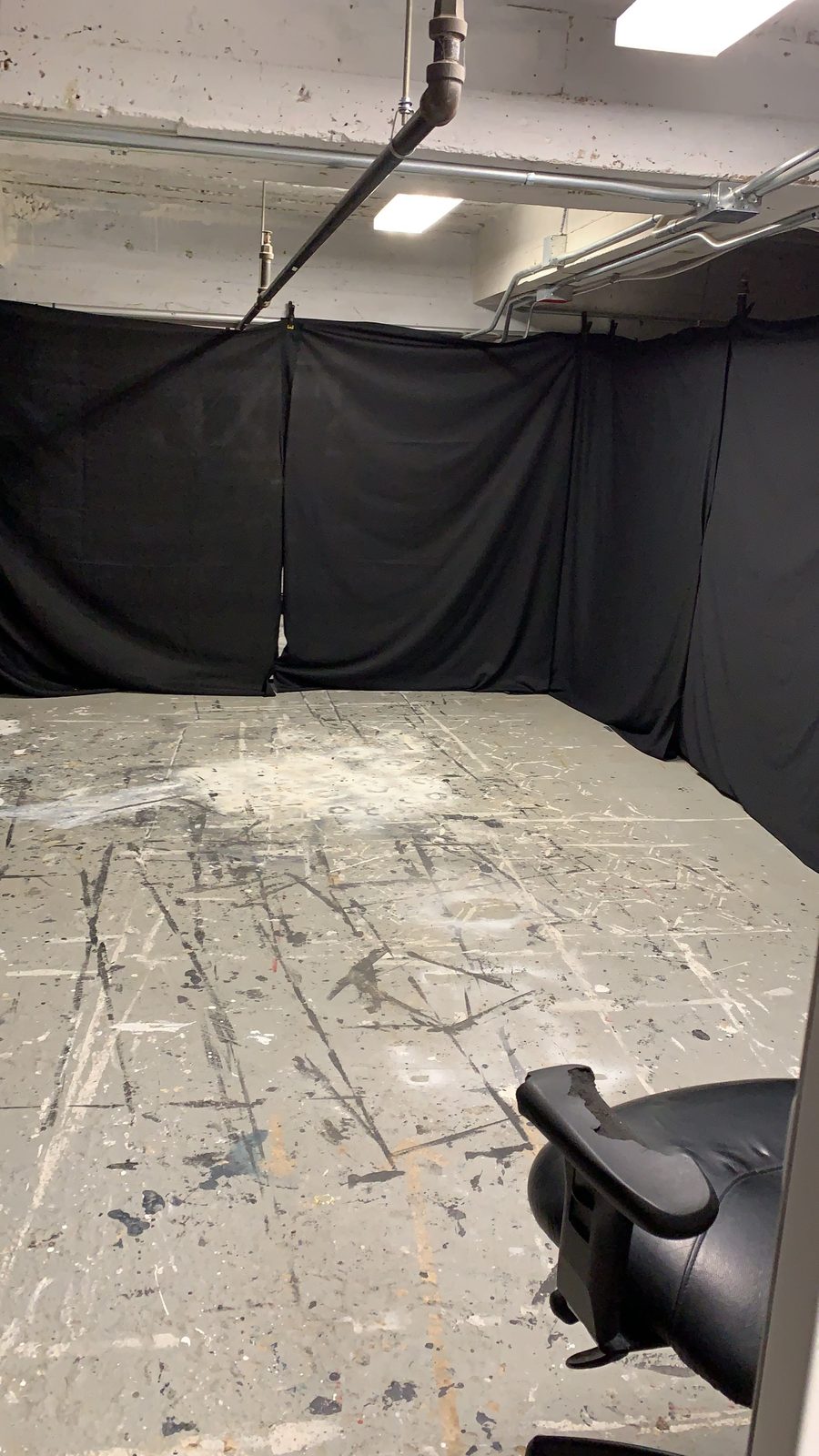 Marked floor inside the darkened performance enclosure
